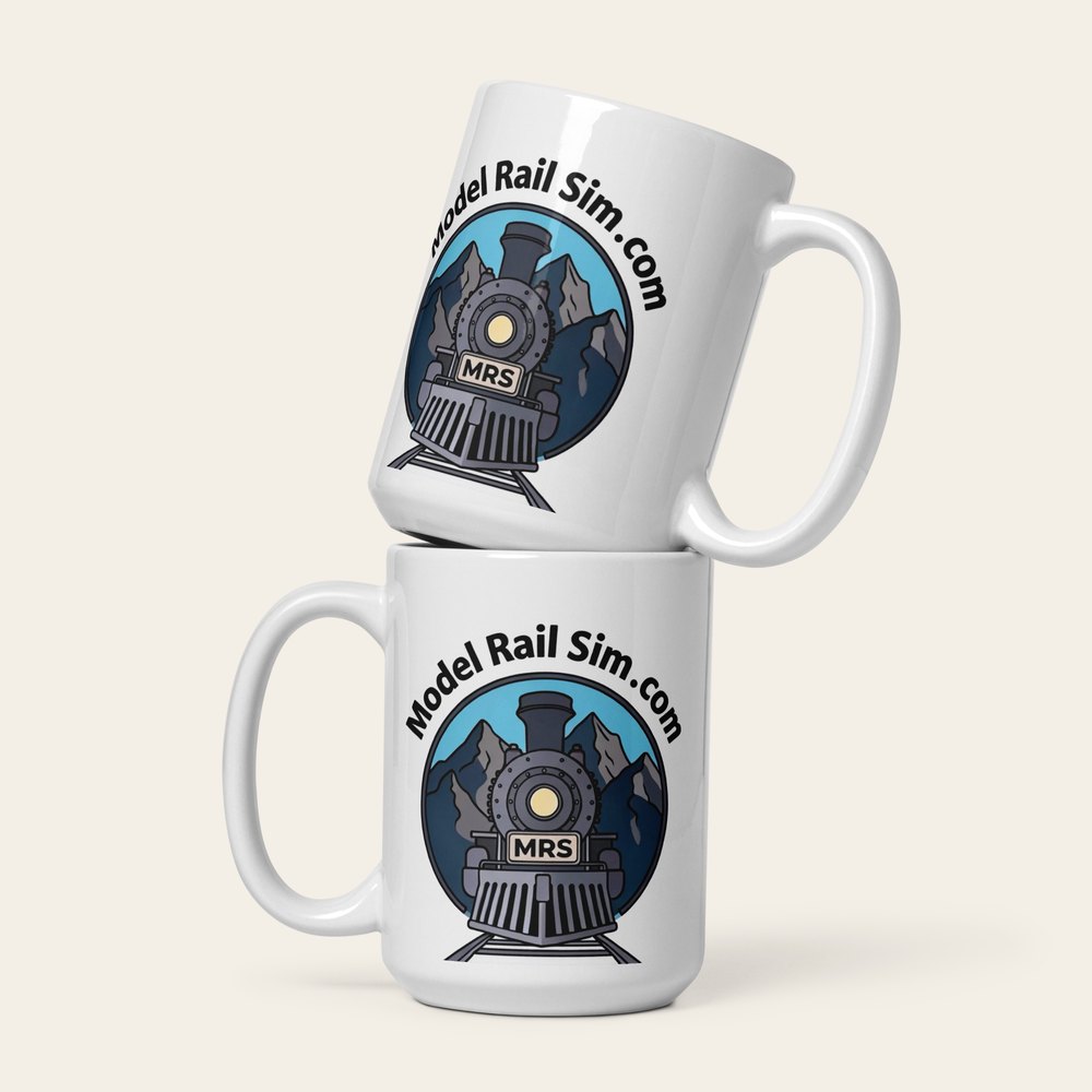 A 15 oz white glossy mug with the modelrailsim locomotive illustration